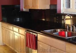 Black granite can pair nicely with white cabinets. Black Galaxy Granite Countertop From United Kingdom 149473 Stonecontact Com