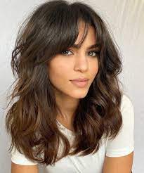 Keep the bangs shorter in the middle and longer at the sides for a modern touch. 50 Haircuts For Thick Wavy Hair To Shape And Alleviate Your Beautiful Mane