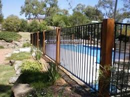13 Latest And Elegant Wrought Iron Pool Fence Ideas Backyard Pool Landscaping Fence Around Pool Glass Pool Fencing