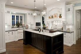 white cabinets with a dark island / for