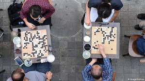 Players alternate placing black and white stones, with the goal to surround and capture their opponent's pieces and territory. 10 Strategy Games That Are Good For Your Brain All Media Content Dw 09 03 2016