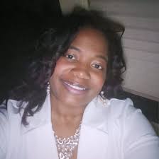 Elishua Brown, summer intern for Kanawha County Clerk Vera McCormick, was  surprised this morning by a visit from Denise Brindley, business teacher  from Capital High School, to present him with a certificate