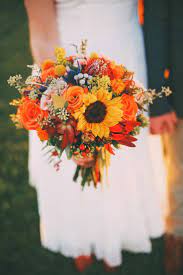 55 wonderful wedding flower arrangements for your big day 2019 youre probably familiar with some of the most common wedding flower arrangements such as bouquets boutonnieres and centerpieces but it turns out that theyre just the tip of the iceberg when it wedding sunflowers. Bright Autumn Sunflower Bridal Bouquet Blue Thistle Billy Balls Rustic Vintage Fa Sunflower Bridal Bouquet Sunflower Wedding Bouquet Bridal Bouquet Fall