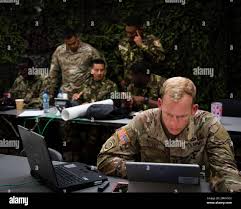 United States Army Captain Daniel Studt participates in the Land Component  Command training during Exercise TRADEWINDS