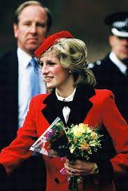 Take a trip back in time with the late royal's most iconic styles. Diana Princess Of Wales Holds A Bouquet Of Flowers During A Visit Princess Diana Photos Princess Diana Pictures Princess Diana