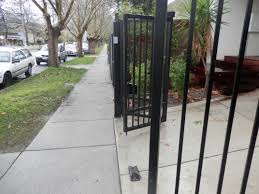 Tmgc Automatic Trackless Bi Fold Gates The Space Saver Bar Grill Style Perfect For Those With Limited Space The Gate Company Automatic Gate Front Gates