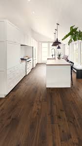 To Get The Most Out Of Those Bright White Cabinets We Ve Paired A Medium Brown Hardwood Floor A Hardwood Floors Dark Hardwood Floor Colors Wood Floor Kitchen
