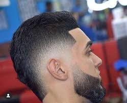 The geometric arabesque shapes of the fade provide a masculine anchor to the soft, kinky texture of the hair on top. 33 Best Mohawk Fade Haircuts Fade Haircut Mens Haircuts Fade Short Fade Haircut