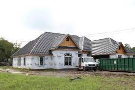 Charcoal is a lightweight black carbon residue produced by strongly heating wood (or other animal and plant materials) in minimal oxygen to remove all water and volatile constituents. New Construction Residential Home With Aluminium Charcoal Grey Roof Standing Seam Roof Amera