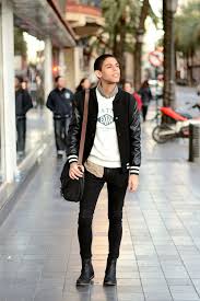 Black And White Varsity Jacket Outfit Men S Black Varsity Jacket White And Black Print Crew Neck Sweater Brown Camouflage Long Sleeve Shirt Black Skinny Jeans Black Skinny Jeans Black Leather Chelsea Boots Men S Leather Jacket
