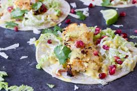 With mexican rice and or cilantro lime rice and enjoy every sweet and spicy refreshingly delicious bite. Crispy Fish Tacos With Pomegranate Pear And Honey Lime Crema Love Zest