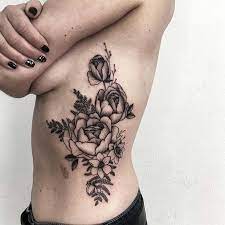 This is quirky and will catch everyone's attention. 43 Badass Tattoo Ideas For Women Stayglam Rose Rib Tattoos Rib Tattoo Rose Rib Tattoo