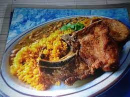 · this authentic puerto rican pork chop recipe provides you with the perfect way to cook a juicy and flavorful pork chop. Fried Pork Chops With Yellow Rice And Beans Picture Of Rincon Criollo Restaurant Cleveland Tripadvisor