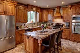 This kitchen incorporates rustic log cabin style with state of the art stainless steel appliances including a three. New Cabinets Home Improvements Of Colorado