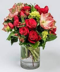 Red Roses Amaryllis And Tulips In A Glass Cylinder Vase Flower Delivery Holiday Floral Arrangements Same Day Flower Delivery