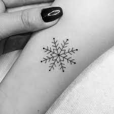 This believe tattoo design includes a heart and cross charm, snowflake charm and a singing bird. 32 Splendid Snowflake Tattoo Designs Page 2 Of 3 Tattoobloq Snow Flake Tattoo Small Snowflake Tattoo Unique Tattoos