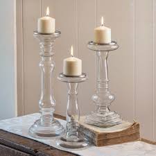 Featuring a large graceful form, this piecefeaturing a large graceful form, this piece will make a fantastic addition to any decor. Set Of Three Glass Pillar Candle Holders Ctw Home Collection