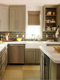 Make A Small Kitchen Look Larger With These Clever Design Tricks Kitchen Remodel Small Kitchen Remodel Brown Kitchen Cabinets