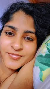 Relaxing Bedroom Scene with Dark Wavy Hair