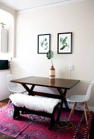 Rustic dining table set with two stools and a narrow kitchen table. Bright Modern Bohemian San Francisco Kitchen Small Apartment Dining Room Apartment Dining Room Small Dining Room Table