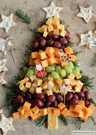 Cut block of cream cheese diagonally in half. Easy Holiday Appetizer Christmas Tree Cheese Board Holiday Appetizers Easy Christmas Snacks Holiday Appetizers Christmas