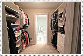 It has a separate shower and bathtub, a toilet with a privacy partition wall, and dual sinks. Closetandbathroom Closet Layout Closet Remodel Master Closet Layout