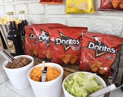 Planning a taco bar for graduation parties and get togethers is a fun and economical way to serve your guests. Create A Walking Taco Bar For Your Next Celebration