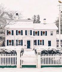 You might manage to put up a christmas tree, sure. White Picket Fence House New England Snow Christmas Wreaths Hanging On Windows Red Ribbons The Glam Pad