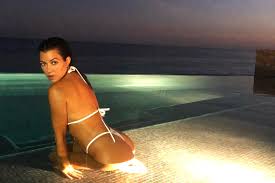 In fact, she really wishes people would stop insisting she is. Kourtney Kardashian Glows In White Thong Bikini During Evening Swim People Com
