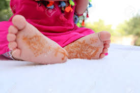Henna is used to tattoo on the body in the indian culture. Little Newborn Baby Feet With A Beautiful Traditional Arabic Henna Tattoo Close Up Picture Of The Small Newborn Baby Feet On A White Blanket Stock Photo Picture And Royalty Free Image Image