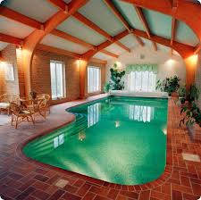 Luxury indoor swimming pool design & installation company based in surrey. Beautiful Indoor Swimming Pool Area With Sitting Space Indoor Swimming Pool Design Swimming Pool House Indoor Pool Design