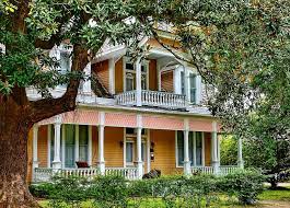 Imagine this simple home without the wraparound porch and it's obvious that something would be missing. Wrap Around Porch Ideas That Shout Summer Networx