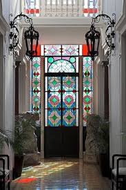 Stylish Ways To Use Stained Glass Panels In Your Home Ramshackle Glam Stained Glass Panels Stained Glass Door Stained Glass Decor