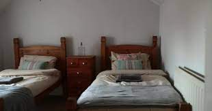 When considering a wooden accent wall for the bedroom, choose between dark and cosy or light and airy feel. Panning Shot Empty Bedroom Two Single Wooden Beds Wall Set Video By C Dglimages Stock Footage 273779614