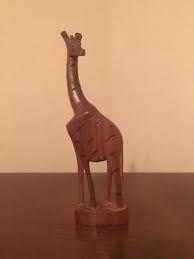 Which adds a visual appeal to the room. Tall Wooden Giraffe Statues