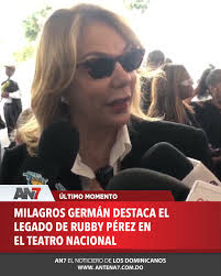 AN7Actualidad| La pasada ministra de Cultura, Milagros Germán, recordó con  emoción el legado de Rubby Pérez durante el velatorio del merenguero en el  Teatro Nacional. Germán destacó la actuación de Pérez en