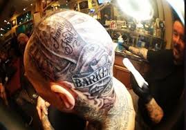 He having a lots of tattooed like cadilac emblems, a boom box radio. Travis Barker S 100 Tattoos Their Meanings Body Art Guru