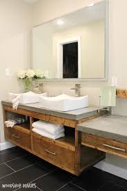 A wire container under a floating vanity allows for extra storage. How To Build A Diy Modern Floating Vanity Or Tv Console