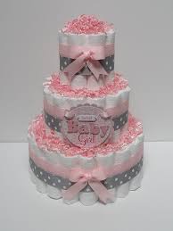 Diaper cakes make the perfect centerpieces for a tablescape at the shower. 11 Diaper Cakes For Girls Pink Photo Pink Girl Baby Shower Diaper Cake Pink Girl Baby Shower Diaper Cake And Girls Diaper Cake In Little Birds Pink Snackncake
