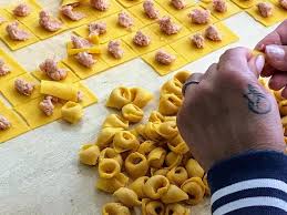 The Past Ladies Of Bologna Filling And Folding Tortellini Homemade Tortellini Tortelloni Tortellini In Brodo