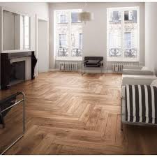 Direction Of The Pattern Is Neither Horizontal Or Vertical But Diagonal Across The Room Herringbone Wood Fl Wood Tiles Design Wood Look Tile Wood Tile Floors