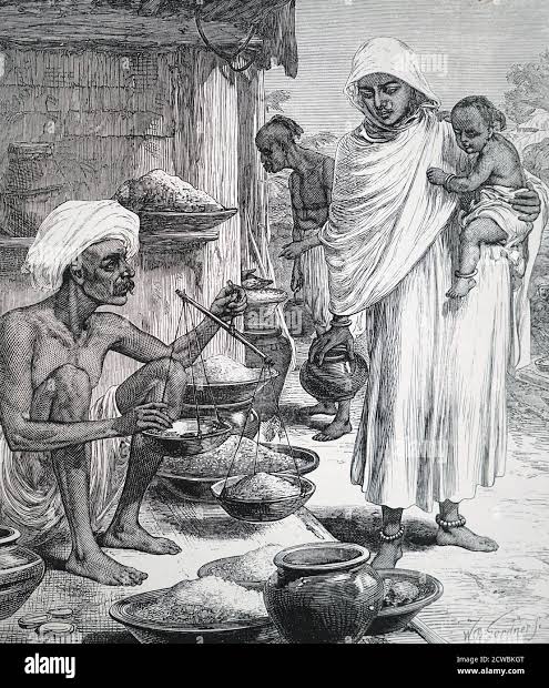 Engraving depicting a Bengali woman buying grain with famine in India impending Stock Photo - Alamy