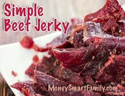Several Slices Of Reddish Brown Beef Jerky Stacked On A Plate Beef Jerky Rezept Rezepte Snack