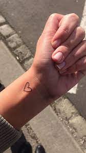 Two love bird and heart tattoo. 10 Tiny Heart Tattoos That We Re Absolutely Obsessed With Shemazing