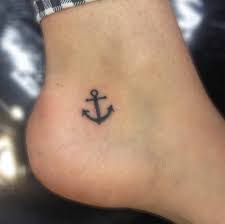 Small oldschool anchor with ribbon and crown on top tattoo on thigh. Anchor Tattoos Small Anchor Tattoos Small Foot Tattoos Anchor Tattoo Ankle