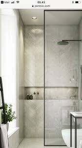Sure, soaker tubs are relaxing, but they are not as practical as showers, which are equally as refreshing. Black Frame Shower Partition Horizontal Niche Herringbone Tile Wallfixtures Wallfixtu Industrial Bathroom Decor Framed Shower Bathroom Interior Design