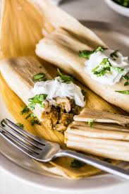 For a 'wet' hot tamale, serve with additional simmering liquid. Green Chicken Tamales Isabel Eats