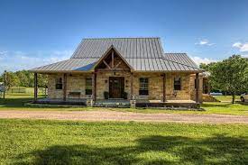 Bask In The Warmth Of The Sun At This Limestone Custom Home W Standing Seam Metal Roof Massive Wood Rustic House Plans Ranch Style Homes Metal Building Homes