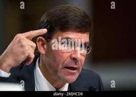 Secretary of the Army and Secretary of Defense nominee Mark Esper is  greeted by his family, from left, daughter Kate Esper, son Luke Esper, his  wife Leah Esper and son John Esper,