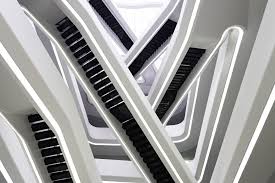 The pink arrows point to all areas of cabinetry: The Dominion Office Building By Zaha Hadid Design Father